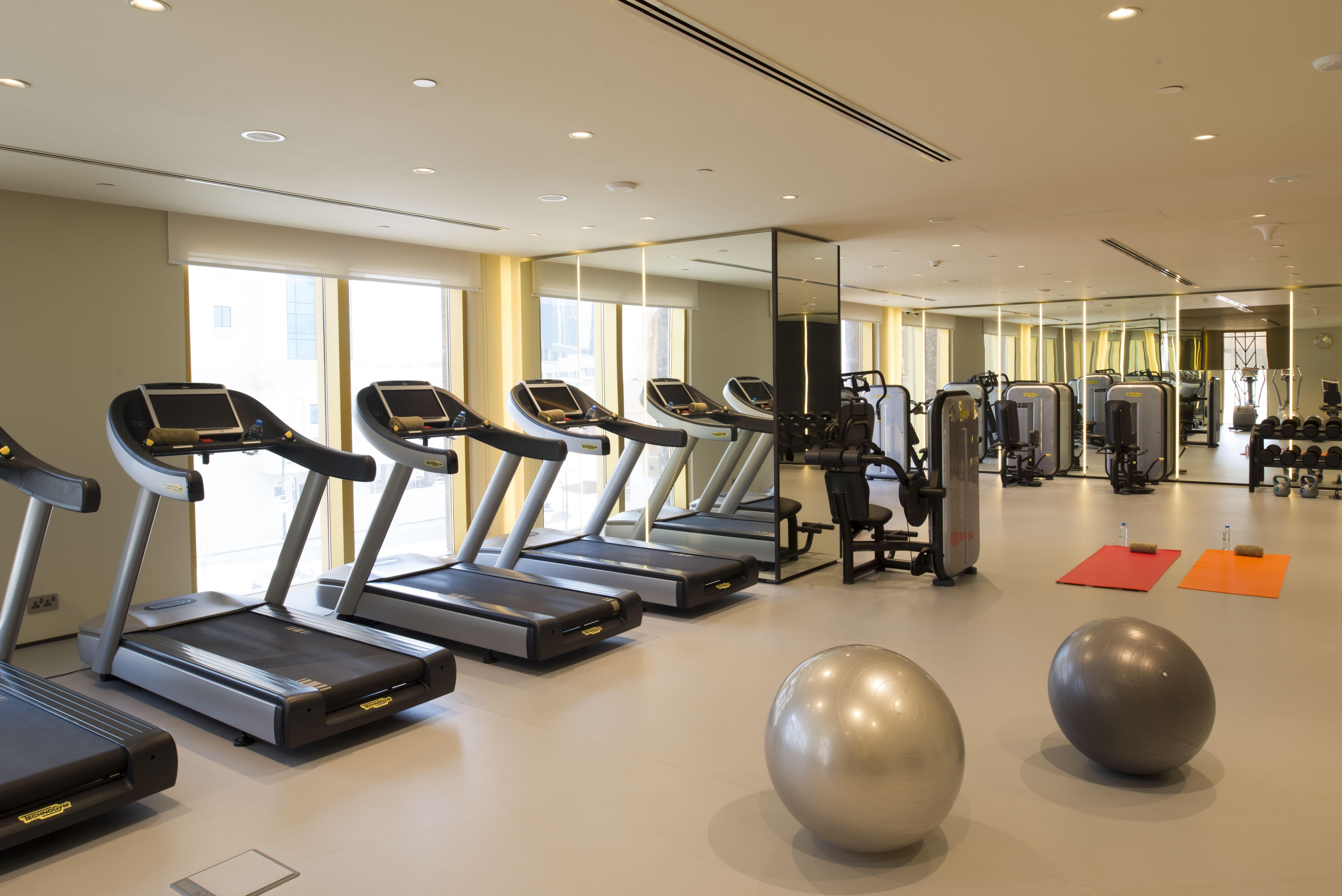 Voco Doha West Bay Suites By Ihg Экстерьер фото The gym at the hotel