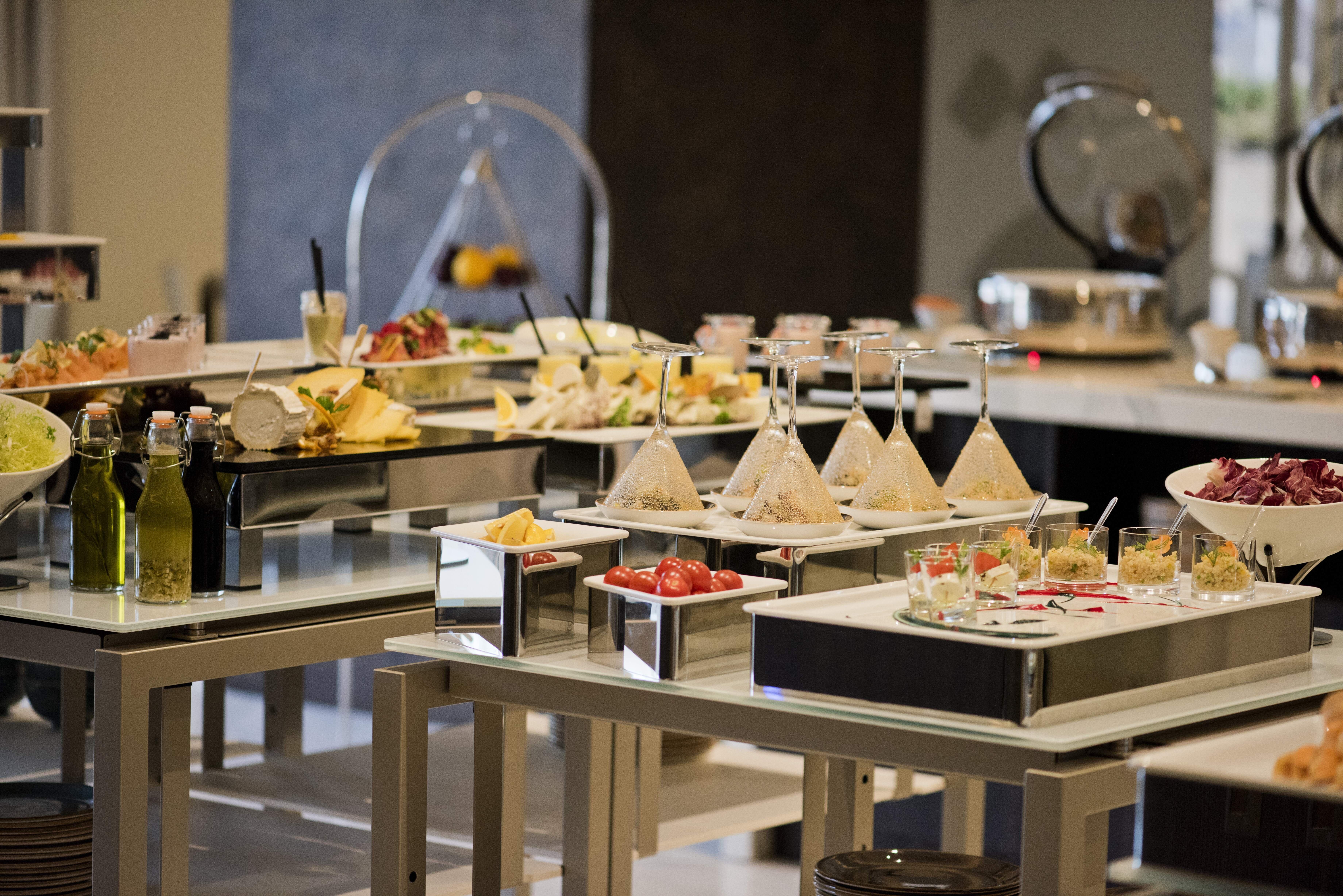 Voco Doha West Bay Suites By Ihg Экстерьер фото A buffet at a hotel