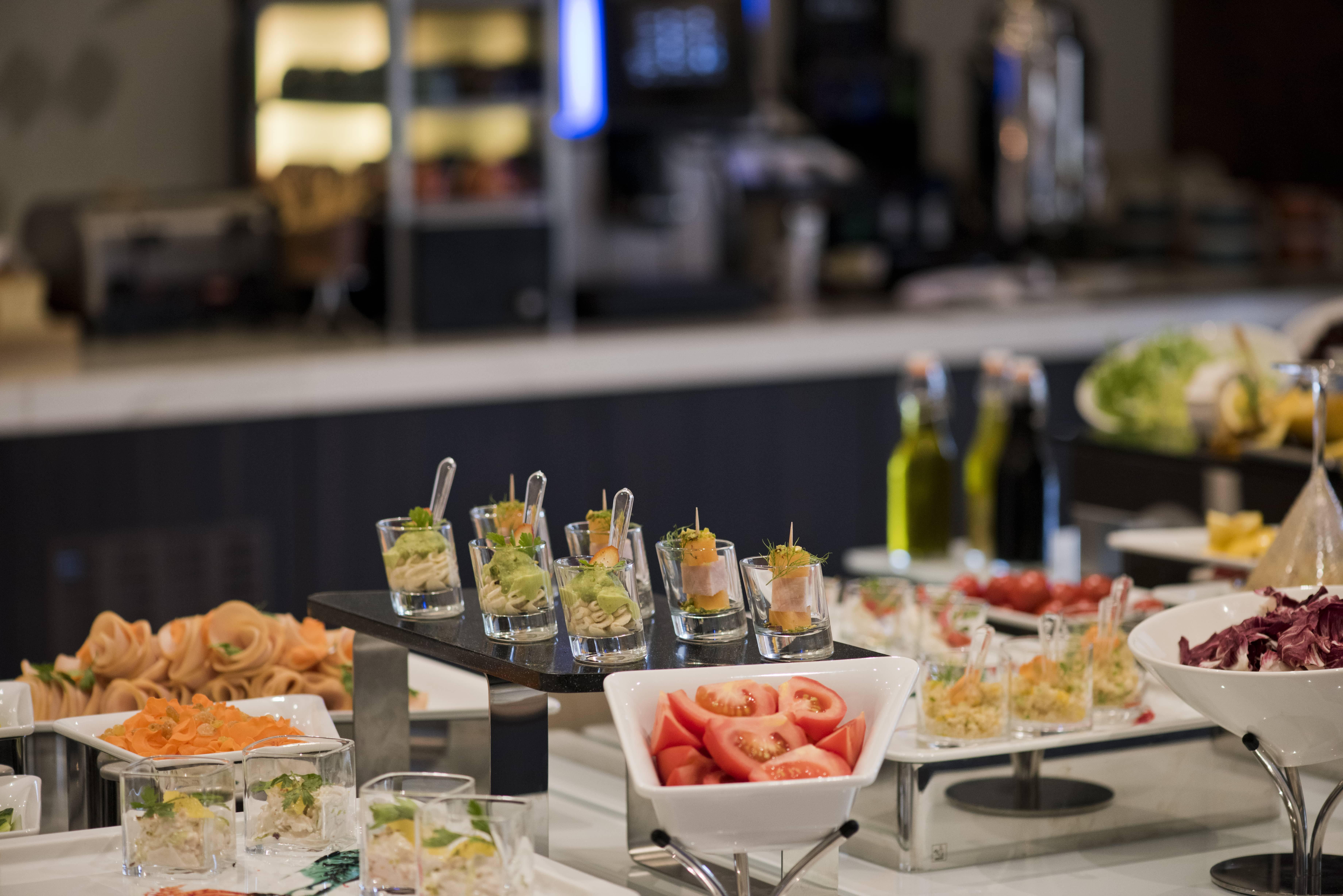 Voco Doha West Bay Suites By Ihg Экстерьер фото A buffet at a hotel